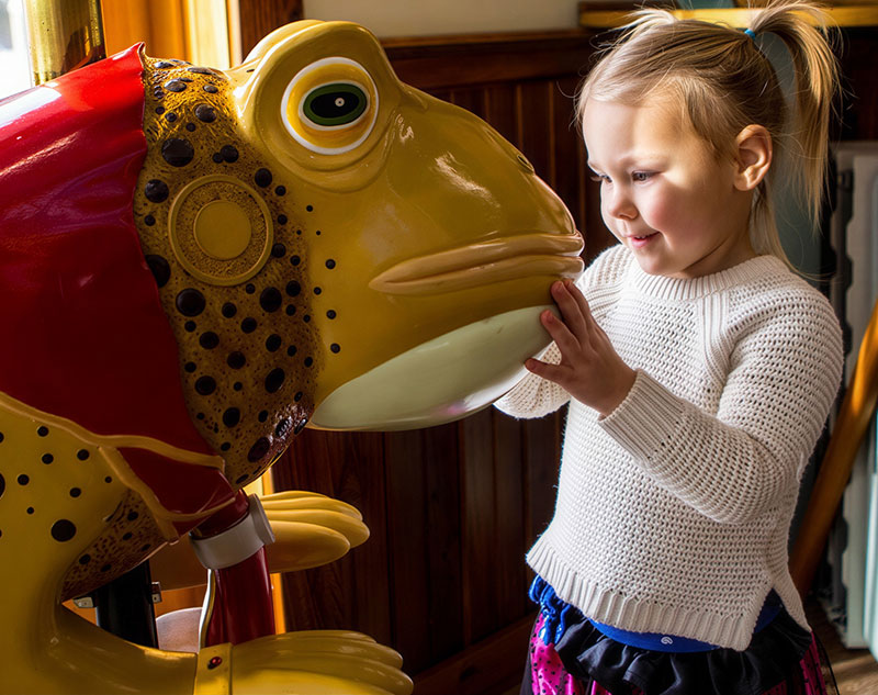 Buck the Toad and girl petting his face